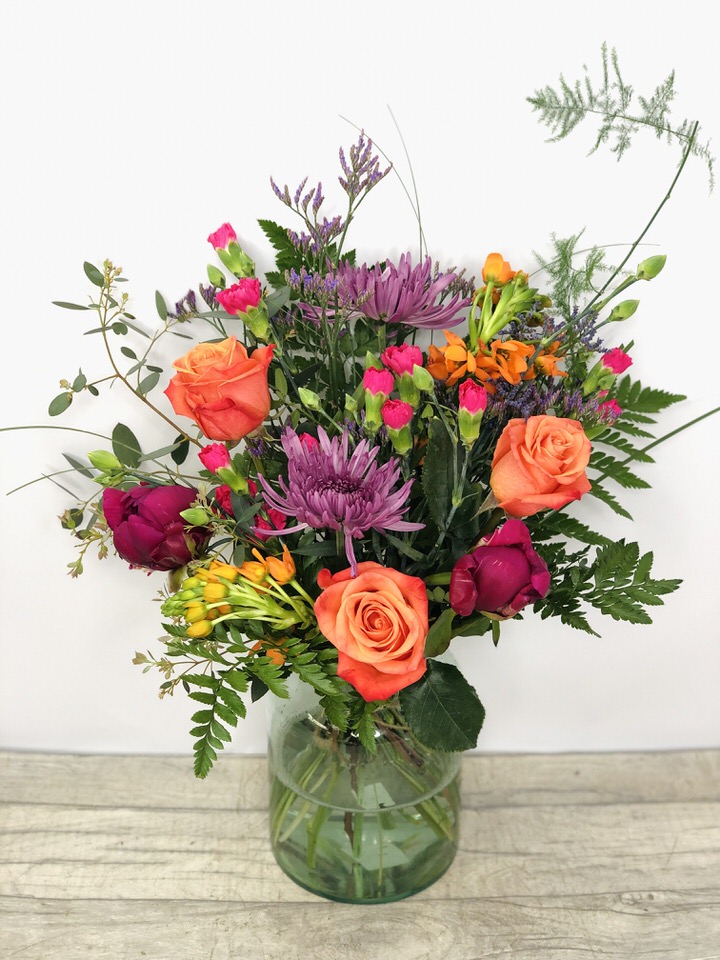 <h2>Summer Vase of Flowers - Hand Delivered</h2>
<p>These beautiful fresh flowers hand-arranged by our professional florists into a glass vase are a delightful choice from our new Summer collection. This vase contains lots of Summer favourites and it would make the perfect gift for any occasion or to let someone know you are thinking of them.</p>
<h2>Flower Delivery Coverage</h2>
<p>Our shop delivers flowers to the following Liverpool postcodes L1 L2 L3 L4 L5 L6 L7 L8 L11 L12 L13 L14 L15 L16 L17 L18 L19 L24 L25 L26 L27 L36 L70 If your order is for an area outside of these we can organise delivery for you through our network of florists. We will ask them to make as close as possible to the image but because of the difference in stock and sundry items, it may not be exact.</p>
<h2>Vase of Flowers | Flowers in a Vase</h2>
<p></p>
<p>The advantage of having an arrangement made this way is that they are artfully arranged by our florists into the vase so that they stay in the display.</p>
<p>Being delivered in a vase and in water means the recipient does not need to arrange the flowers themselves, they can just put them down and enjoy.</p>
<p>Featuring  3 orange roses, 4 cerise spray carnations, 2 orange chinneys, 2 Cerise Peony, 2 purple blooms, 1 limo, mixed foliage's including Asparagus fern, bear grass, Eucalyptus and leather.</p>
<h2>Eco-Friendly Liverpool Florists</h2>
<p>As florists we feel very close earth and want to protect it. Plastic waste is a huge problem in the florist industry so we made the decision to make our packaging eco-friendly.</p>
<p>To achieve this, we worked with our packaging supplier to remove the lamination off our boxes and wrap the tops in an Eco Flowerwrap, which means it easily compostable or can be fully recycled.</p>
<p>Once you've finished enjoying your flowers from us, they will go back into growing more flowers! Only a small amount of plastic is used as a water bubble and this is biodegradable.</p>
<p>Even the sachet of flower food included with your bouquet is compostable.</p>
<p>All our bouquets have small wooden ladybird hidden amongst them, so do not forget to spot the ladybird and post a picture on our social media pages to enter our rolling competition.</p>
<h2>Flowers Guaranteed for 7 Days</h2>
<p>Our 7-day freshness guarantee should give you confidence that we will only send out good quality flowers.</p>
<p>Leave it in our hands we will create a marvellous bouquet which will not only look good on arrival but will continue to delight as the flowers bloom.</p>
<h2>Liverpool Flower Delivery</h2>
<p>We are open 7 days a week and offer advanced booking flower delivery, same-day flower delivery, 3-hour flower delivery. Guaranteed AM PM or Evening Flower Delivery and also offer Sunday Flower Delivery.</p>
<p>Our florists deliver in Liverpool and can provide flowers for you in Liverpool, Merseyside. And through our network of florists can organise flower deliveries for you nationwide.</p>
<h2>The Best Florist in Liverpool, your local Liverpool Flower Shop</h2>
<p>Come to Booker Flowers and Gifts Liverpool for your beautiful flowers and plants. For that bit of extra luxury, we also offer a lovely range of finishing touches, such as wines, champagne, locally crafted Gin and Rum, vases, Scented Candles and Chocolates that can be delivered with your flowers.</p>
<p>To see the full range, see our extras section.</p>
<p>You can trust Booker Flowers and Gifts of delivery the very best for you.</p>
<p><em>5 Star review on Yell.com</em></p>
<p><em>Thank you Gemma for your fabulous service. The flowers are of the highest quality and delivered with a warm smile. My sister was delighted. Ordering was simple and the communications were top-notch. I will definitely use your services again.</em></p>